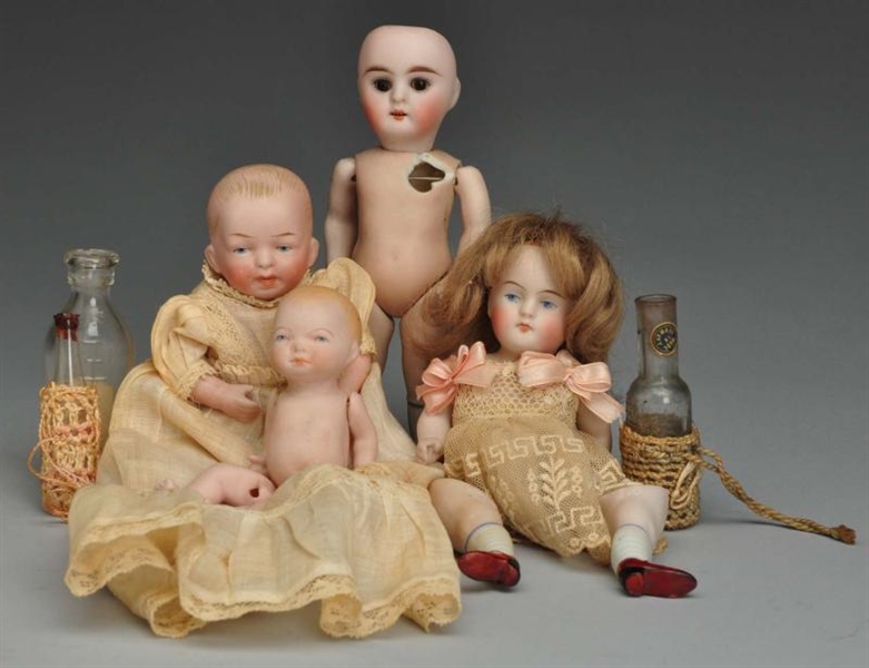 LOT OF 4: ALL-BISQUE DOLLS.                       