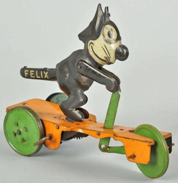 TIN CHEIN FELIX THE CAT SCOOTER WIND-UP TOY.      