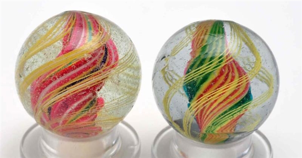 LOT OF 2: SOLID CORE SWIRL MARBLES.               