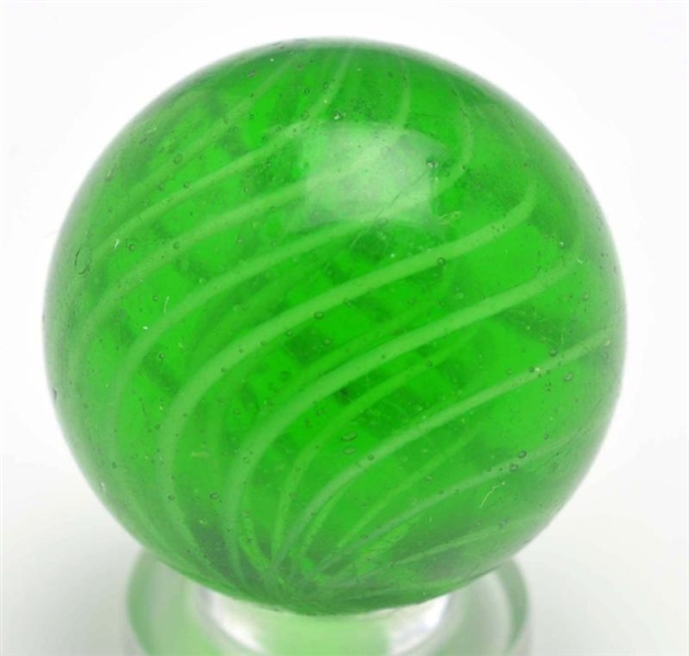 GREEN GLASS LATTICINO SWIRL MARBLE.               