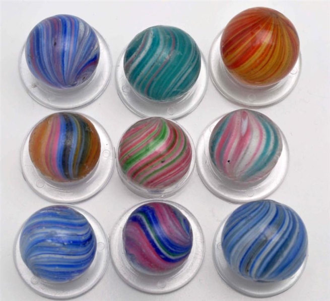 LOT OF 9: ASSORTED ONIONSKIN MARBLES.             