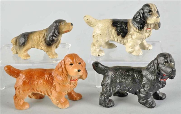 LOT OF 4: CAST IRON COCKER SPANIEL PAPERWEIGHTS.  
