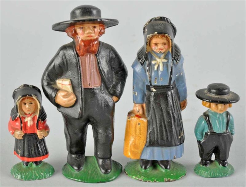LOT OF 4: CAST IRON AMISH FAMILY PAPERWEIGHTS.    