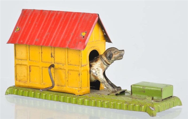 TIN LITHO DOG IN DOGHOUSE PENNY TOY.              