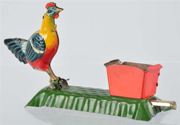 TIN LITHO ROOSTER PECKING PENNY TOY.              