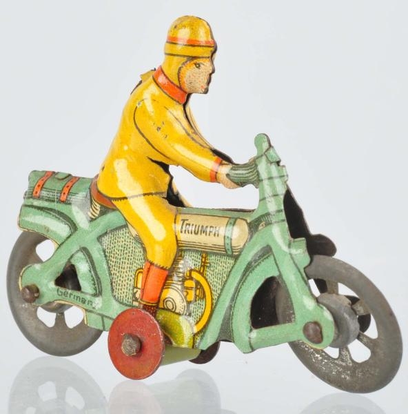 TIN LITHO MOTORCYCLE PENNY TOY.                   
