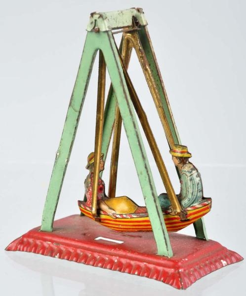 TIN LITHO SWING PENNY TOY.                        