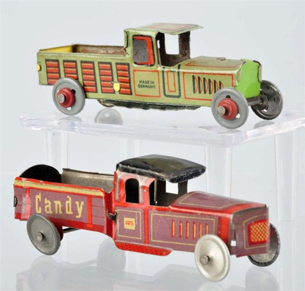 LOT OF 2: TIN LITHO TRUCK PENNY TOYS.             