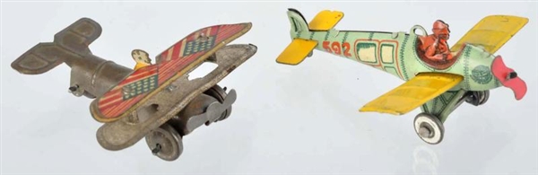 LOT OF 2: TIN LITHO AIRPLANE PENNY TOYS.          