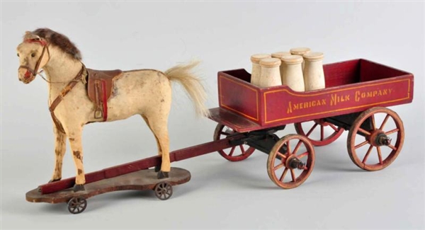 HIDE COVERED HORSE PULL TOY WITH MILK WAGON.      