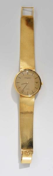 18K MENS ATTACHED BAND WRIST WATCH.               