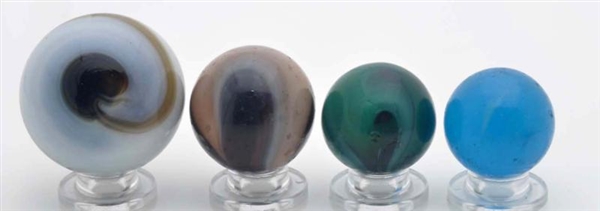 LOT OF 4: TRANSITIONAL MARBLES.                   