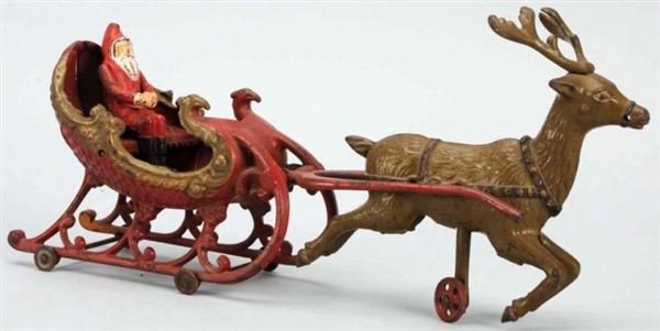 CAST IRON SANTA IN SLEIGH PULL TOY.               