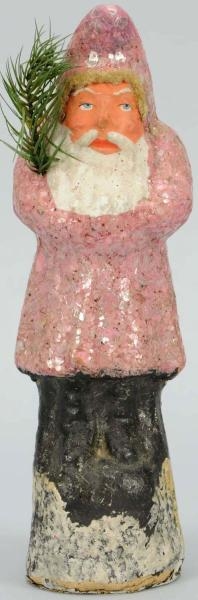 PAPER MACHE BELSNICKLE WITH PINK COAT.            