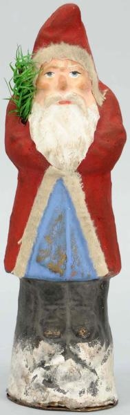 PAPER MACHE BELSNICKLE SANTA WITH RED COAT.       