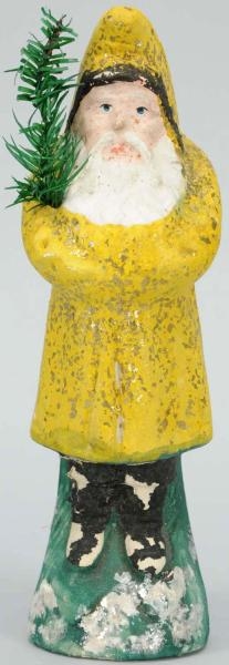 PAPER MACHE BELSNICKLE WITH YELLOW COAT.          