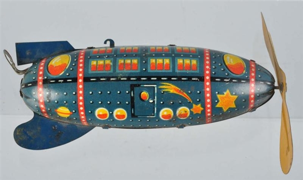 TIN LITHO SPACE ROCKET WIND-UP TOY.               