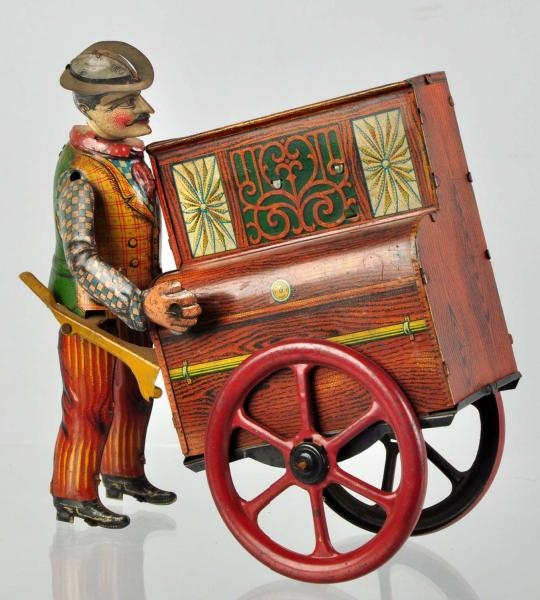 TIN LITHO PETE THE ORGAN GRINDER WIND-UP TOY.     