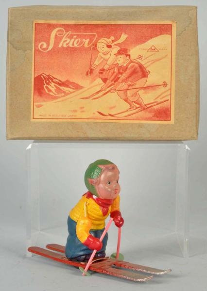 CELLULOID SKIER WIND-UP TOY.                      