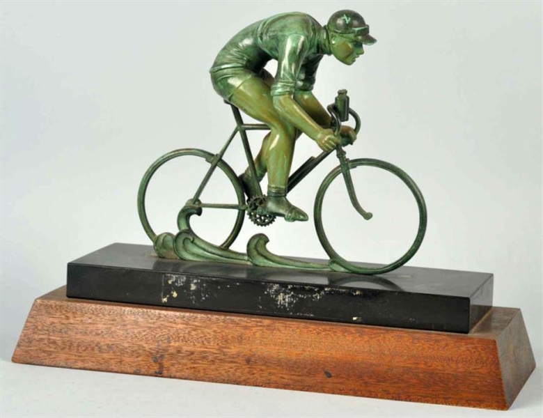 BRONZE BICYCLIST ON MARBLE & WOODEN BASE.         