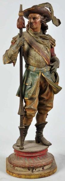 PAINTED METAL STATUE OF MUSKETEER HOLDING STAFF.  