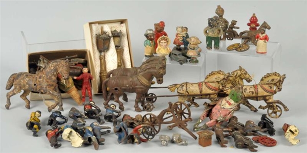 LARGE LOT OF CAST IRON PARTS & PAPERWEIGHTS.      