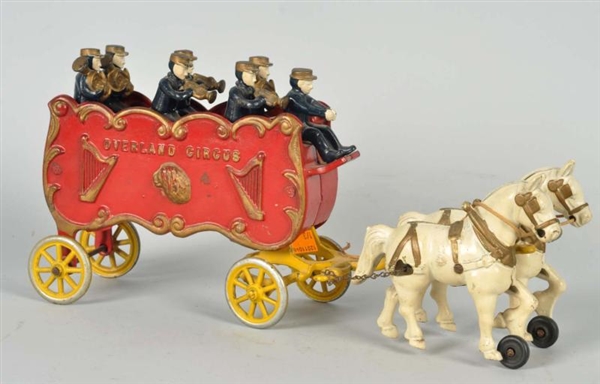 CAST IRON HORSE-DRAWN OVERLAND CIRCUS WAGON TOY.  