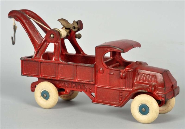 CAST IRON CHAMPION TOW TRUCK TOY.                 