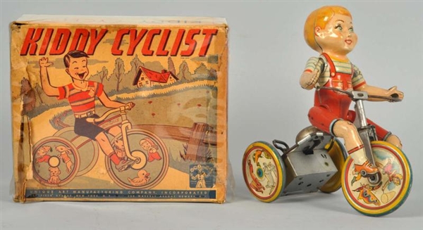 TIN LITHO UNIQUE ART KIDDY CYCLIST WIND-UP TOY.   