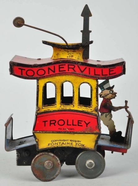 TIN LITHO NIFTY TOONERVILLE TROLLEY WIND-UP TOY.  