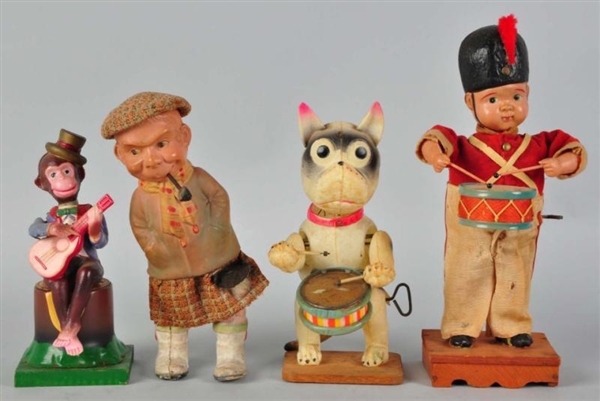 LOT OF 4: CELLULOID FIGURAL WIND-UP TOYS.         