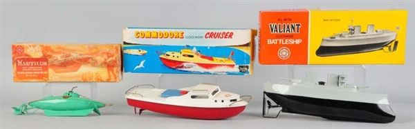 LOT OF 3: TIN SUTCLIFF BOAT WIND-UP TOYS.         