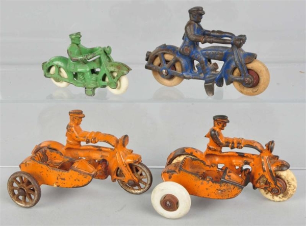 LOT OF 4: CAST IRON MOTORCYCLE TOYS.              