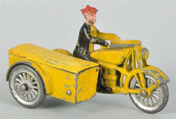 TOOTSIETOY DIECAST SMITTY ON MOTORCYCLE TOY.      