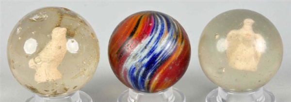 LOT OF 3: TOY MARBLES.                            