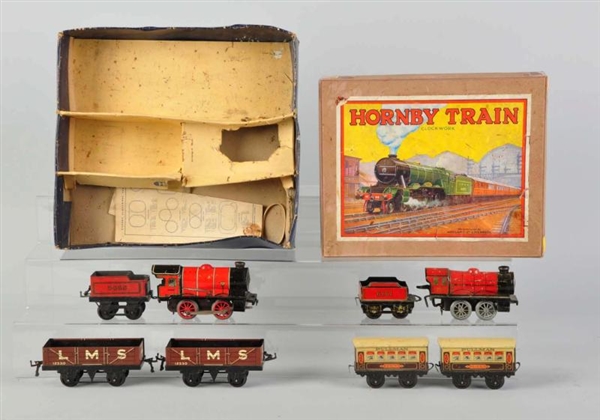 LOT OF 2: TIN LITHO HORNBY WIND-UP TRAIN SETS.    