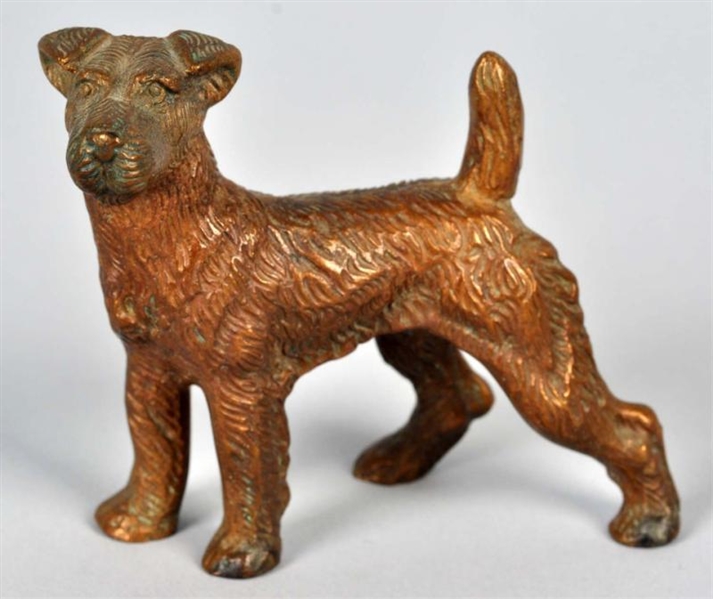 CAST IRON WIRE-HAIRED DOG PATTERN PAPERWEIGHT.    