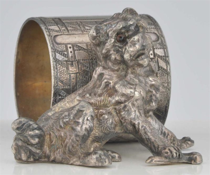 DOG WITH GLASS EYES FIGURAL NAPKIN RING.          