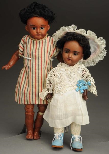 LOT OF 2 BROWN BISQUE DOLLS.                      