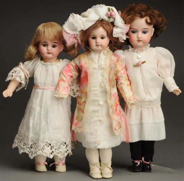 LOT OF 3 BISQUE DOLLS.                            