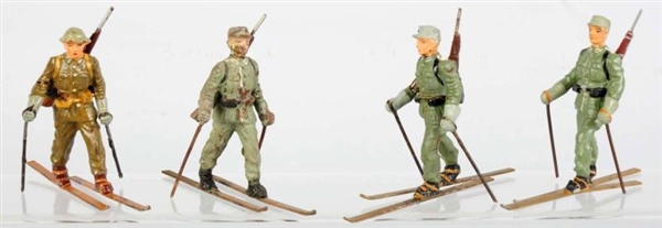 LOT OF 4: LINEOL SKIERS.                          