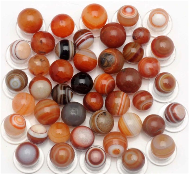 LOT OF 25: HAND-MADE AGATE MARBLES.               