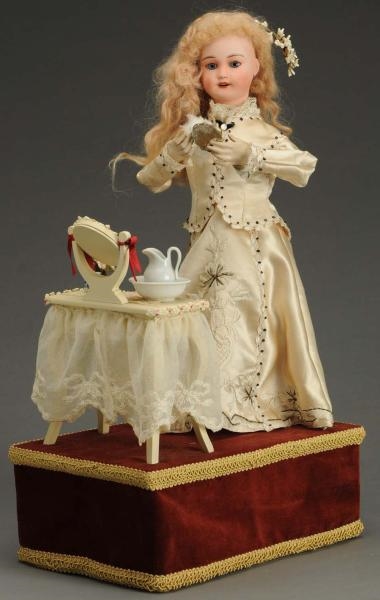 FRENCH MECHANICAL DOLL.                           