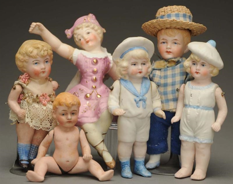 LOT OF 6 ALL BISQUE DOLLS.                        