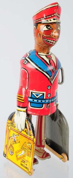 TIN LITHO MARX RED CAP PORTER WIND-UP TOY.        