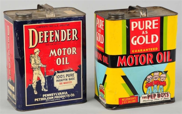 PURE AS GOLD & DEFENDER MOTOR OIL CANS.           