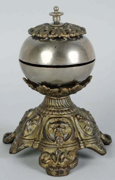 BRASS TWIST SERVICE BELL WITH FACES IN BASE.      