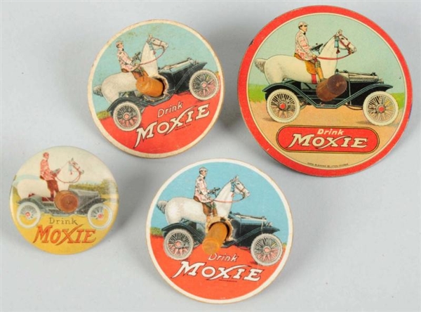 LOT OF 4: ASSORTED MOXIE SPINNING TOPS.           