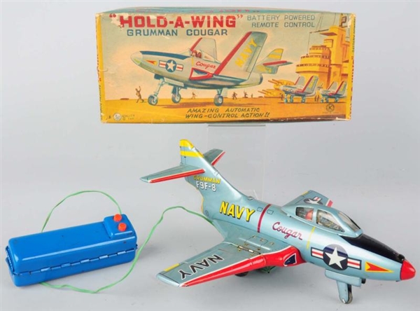 TIN LITHO COUGAR JET FIGHTER AIRPLANE TOY.        