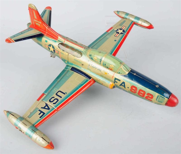 TIN LITHO STARFIRE AIRPLANE FRICTION TOY.         